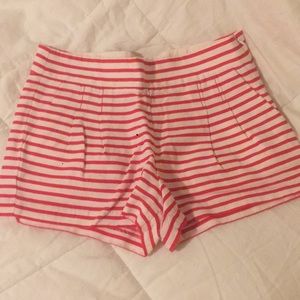 J. Crew red and white striped pleated shorts.